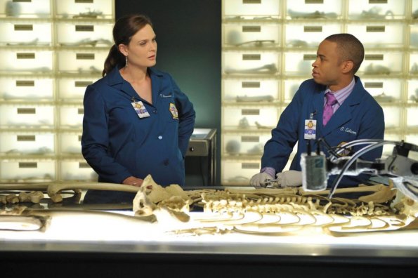 BONES:  Brennan (Emily Deschanel, L) and Jeffersonian intern Dr. Clark Edison (Eugene Byrd, R) examine remains found in boxes at a dead letter office in &quot;The Male in the Mail&quot; episode of BONES airing Thursday, Dec. 1 (9:00-10:00 PM ET/PT) on FOX.  &#xa9;2011 Fox Broadcasting Co.  Cr:  Richard Foreman/FOX