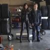 BREAKING IN:  Melanie (Odette Annable, L) and Cameron (Bret Harrison, R) go undercover at a NASCAR race track in the &quot;Need for Speed&quot; episode of BREAKING IN airing Wednesday, April 20 (9:30-10:00 PM ET/PT) on FOX.  &#xa9;2011 Fox Broadcasting Co.  Cr:  Patrick Wymore/FOX