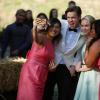 GLEE: Tina (Jenna Ushkowitz, L), Sam (Chord Overstreet, second from L), Kitty (Becca Tobin, third from L) and Mercedes (Amber Riley, R) take a selfie at Brittany and Santana's wedding in the "Wedding" episode of GLEE airing Friday, Feb. 20 (9:00-10:00 PM ET/PT) on FOX. ©2015 Fox Broadcasting Co. CR: Adam Rose/FOX