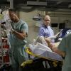 "Stop the Bleeding" -- Gibbs (Mark Harmon) fights for his life aboard a Navy hospital ship after being shot, while DiNozzo and Joanna Teague travel to Shanghai to try and take down the Calling, on the 13th season premiere of NCIS, Tuesday, Sept. 22 (8:00-9:00 PM, ET/PT), on the CBS Television Network. Jon Cryer (Pictured holding chart) begins a multi-episode arc as Gibbs\' surgeon, Dr. Cyril Taft.  Photo: Sonja Flemming/CBS ÃÂ©2015 CBS Broadcasting, Inc. All Rights Reserved
