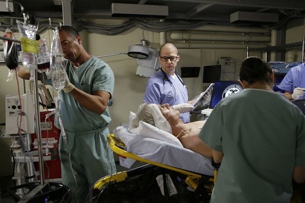 "Stop the Bleeding" -- Gibbs (Mark Harmon) fights for his life aboard a Navy hospital ship after being shot, while DiNozzo and Joanna Teague travel to Shanghai to try and take down the Calling, on the 13th season premiere of NCIS, Tuesday, Sept. 22 (8:00-9:00 PM, ET/PT), on the CBS Television Network. Jon Cryer (Pictured holding chart) begins a multi-episode arc as Gibbs\' surgeon, Dr. Cyril Taft.  Photo: Sonja Flemming/CBS ÃÂ©2015 CBS Broadcasting, Inc. All Rights Reserved