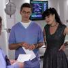 "Twofer" -- NCIS is called in to investigate when the body of a missing Navy Lieutenant who disappeared a year and a half ago is located by a cemetery grounds crew while they are relocating caskets on the property. Also, Gibbs and McGee must pass a psych evaluation with Doctor Grace Confalone (Laura San Giacomo) before officially resuming all work responsibilities, on NCIS, Tuesday, Oct. 3 (8:00-9:00 PM, ET/PT) on the CBS Television Network. Pictured:  David McCallum, Brian Dietzen, Pauley Perrette.  Photo: Robert Voets/CBS ÃÂ©2017 CBS Broadcasting, Inc. All Rights Reserved
