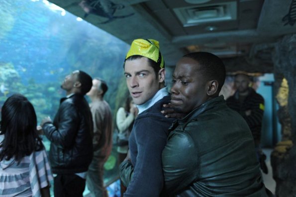 NEW GIRL:  Schmidt (Max Greenfield, L) becomes obsessed with a fish when he and Winston (Lamorne Morris, R) visit the aquarium in the "Guys Night" episode of NEW GIRL airing Tuesday, March 12 (9:00-9:30 PM ET/PT) on FOX.  ©2013 Fox Broadcasting Co.  Cr:  Ray Mickshaw/FOX