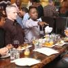 NEW GIRL:  Winston (Lamorne Morris, second from R) invades a communal table at a hot new restaurant in order to save enough seats for the gang in the "Double Date" episode of NEW GIRL airing Tuesday, Oct. 1 (9:00-9:30 PM ET/PT) on FOX.  ©2013 Fox Broadcasting Co.  Cr: Patrick Wymore/FOX